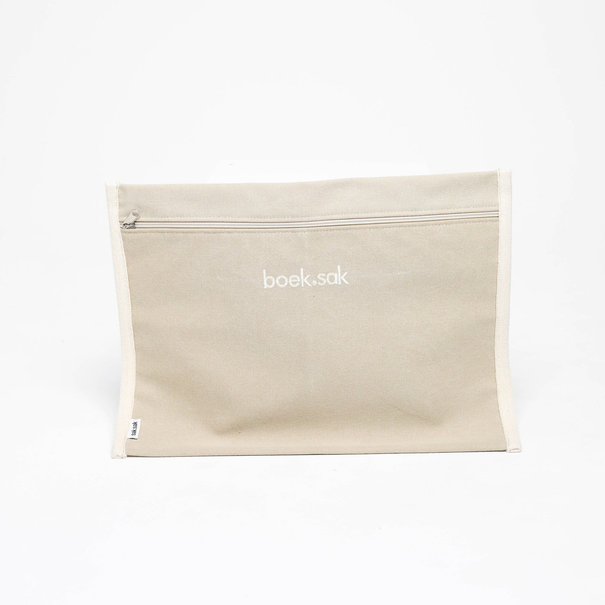 Beige pouch with 'book bag' branding on a white background