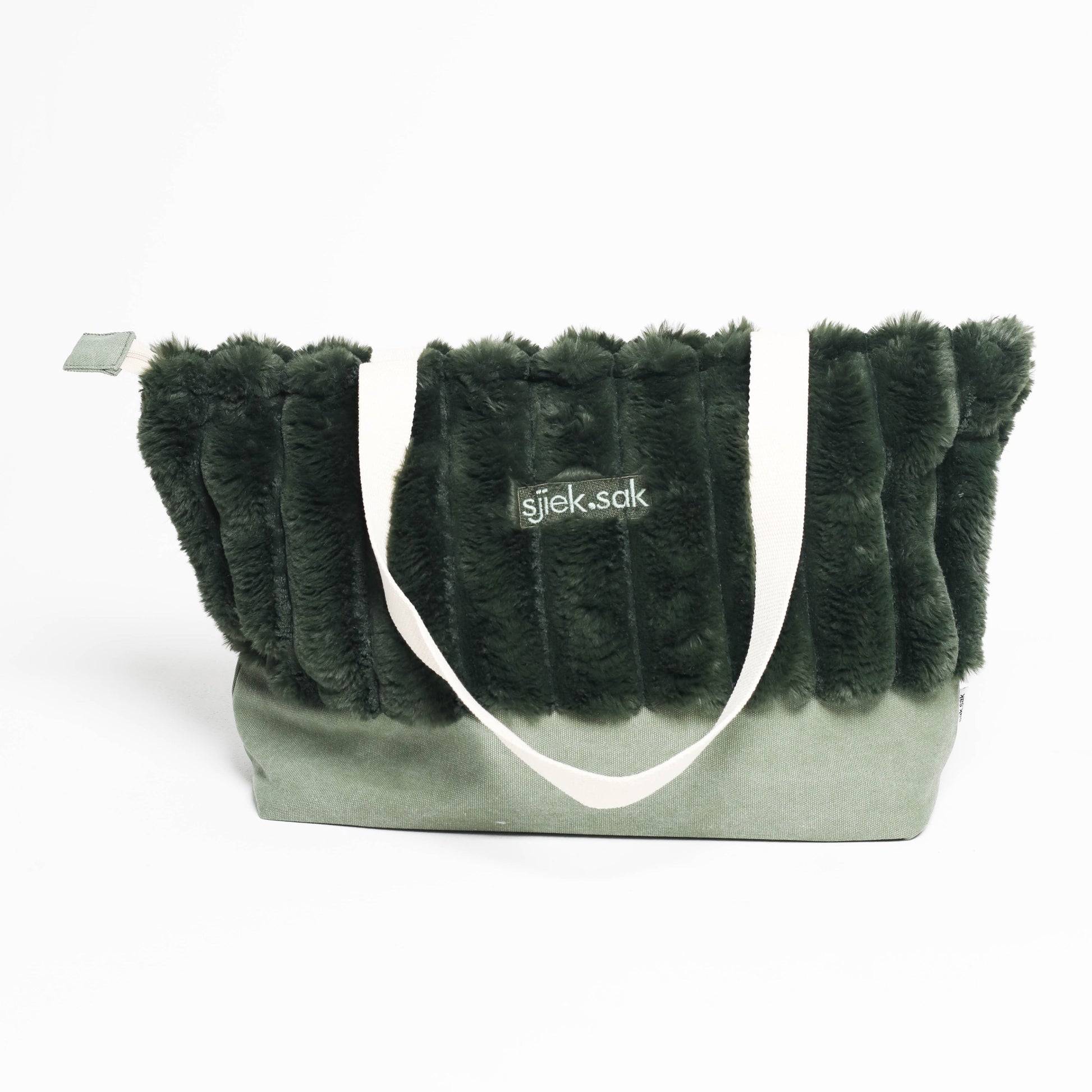 Green furry tote bag with a visible brand logo on a white background