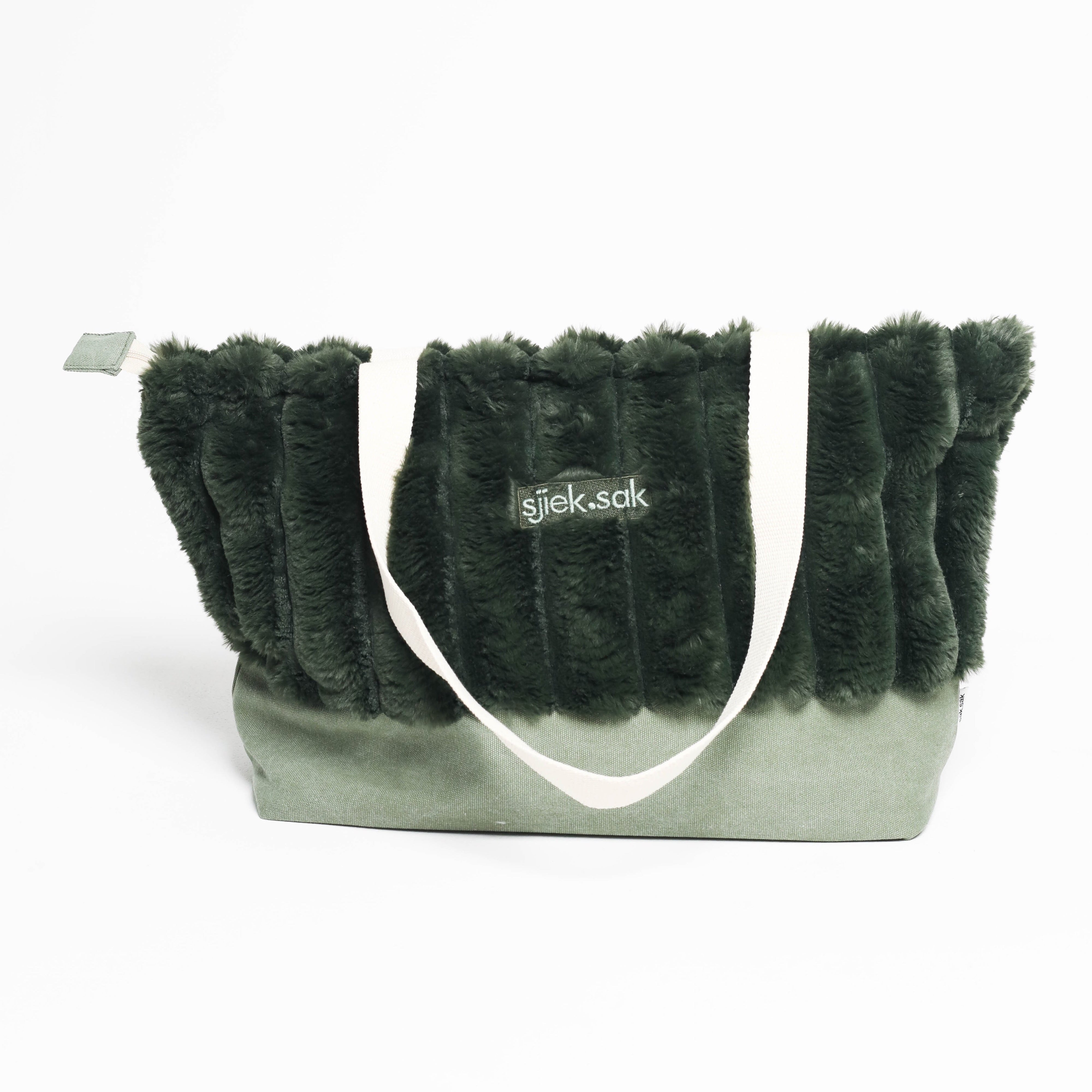 Green furry tote bag with a visible brand logo on a white background
