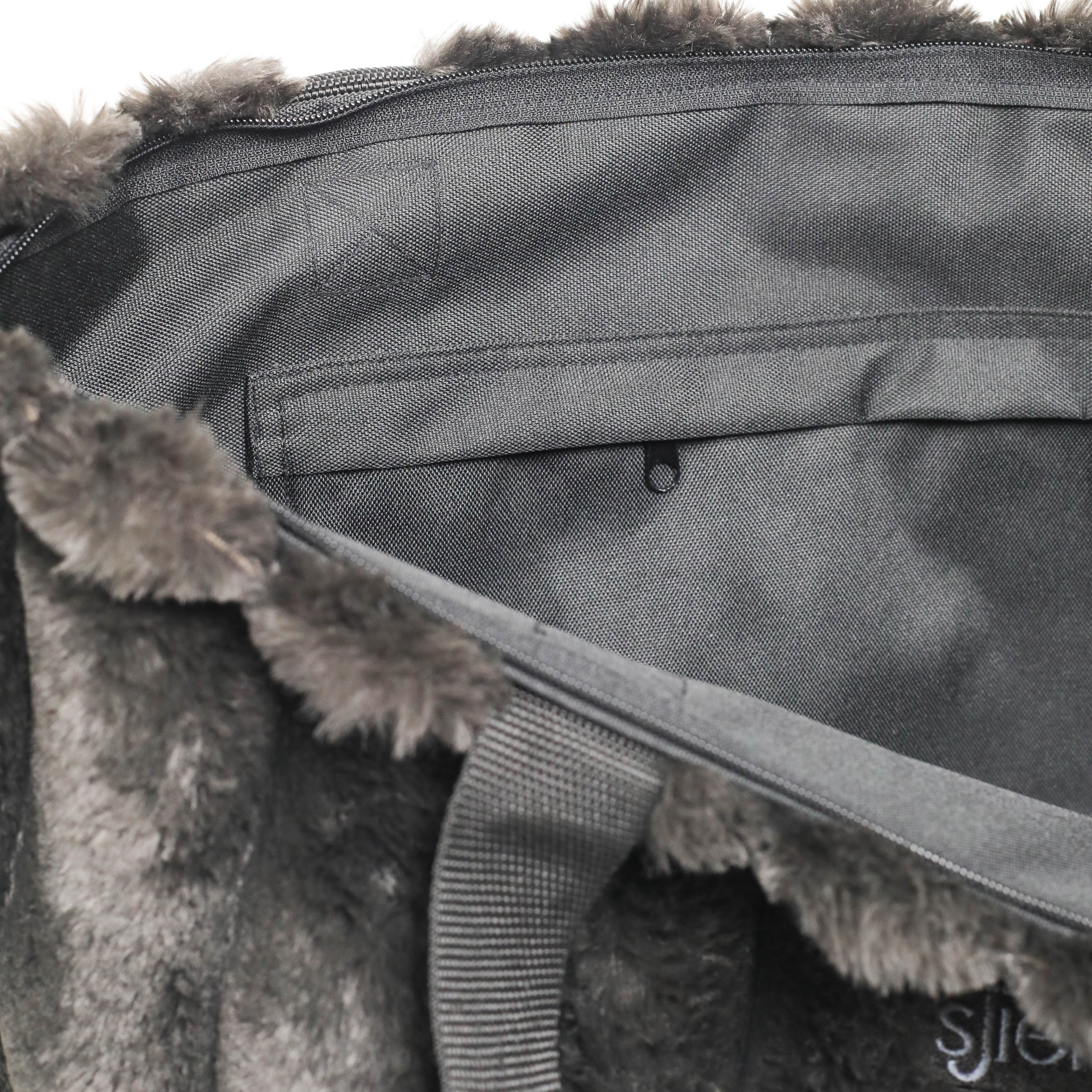 Gray bag with fur trim on a white background