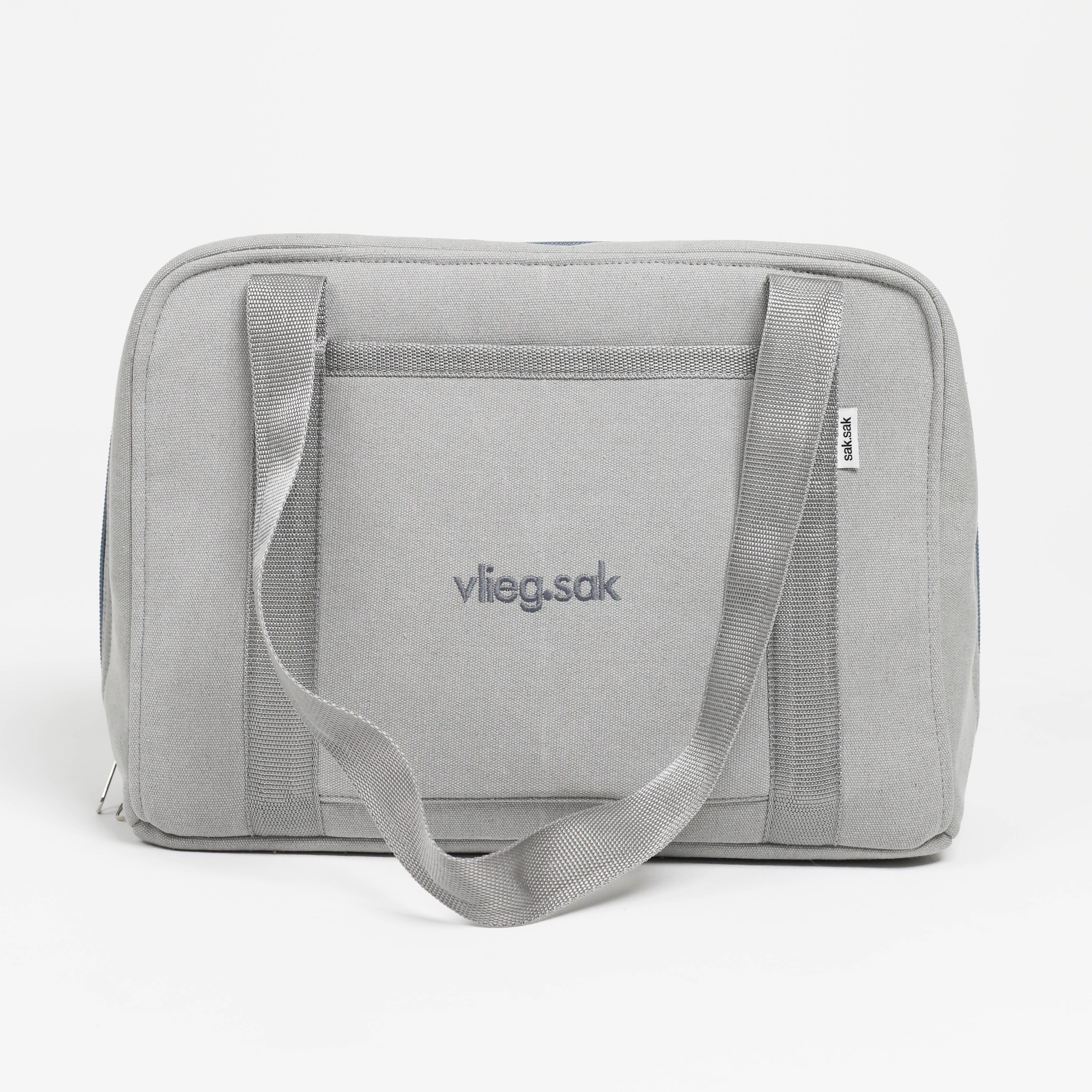 Gray toiletry bag with shoulder strap on a white background